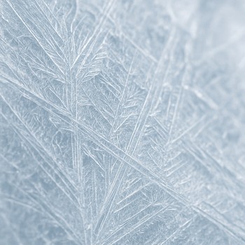 Textured ice surface with faint snow lines and drilled holes