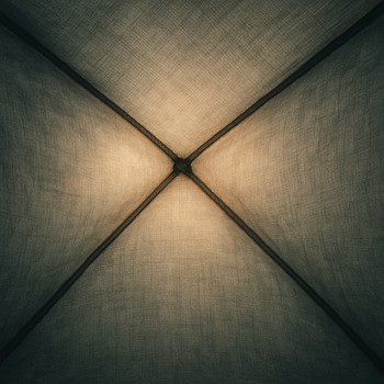 Tent fabric gently moving with wind in soft light